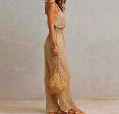 elegant brown halter jumpsuit for women side view with fitted waist sophisticated feminine fashion perfect for events and occasions