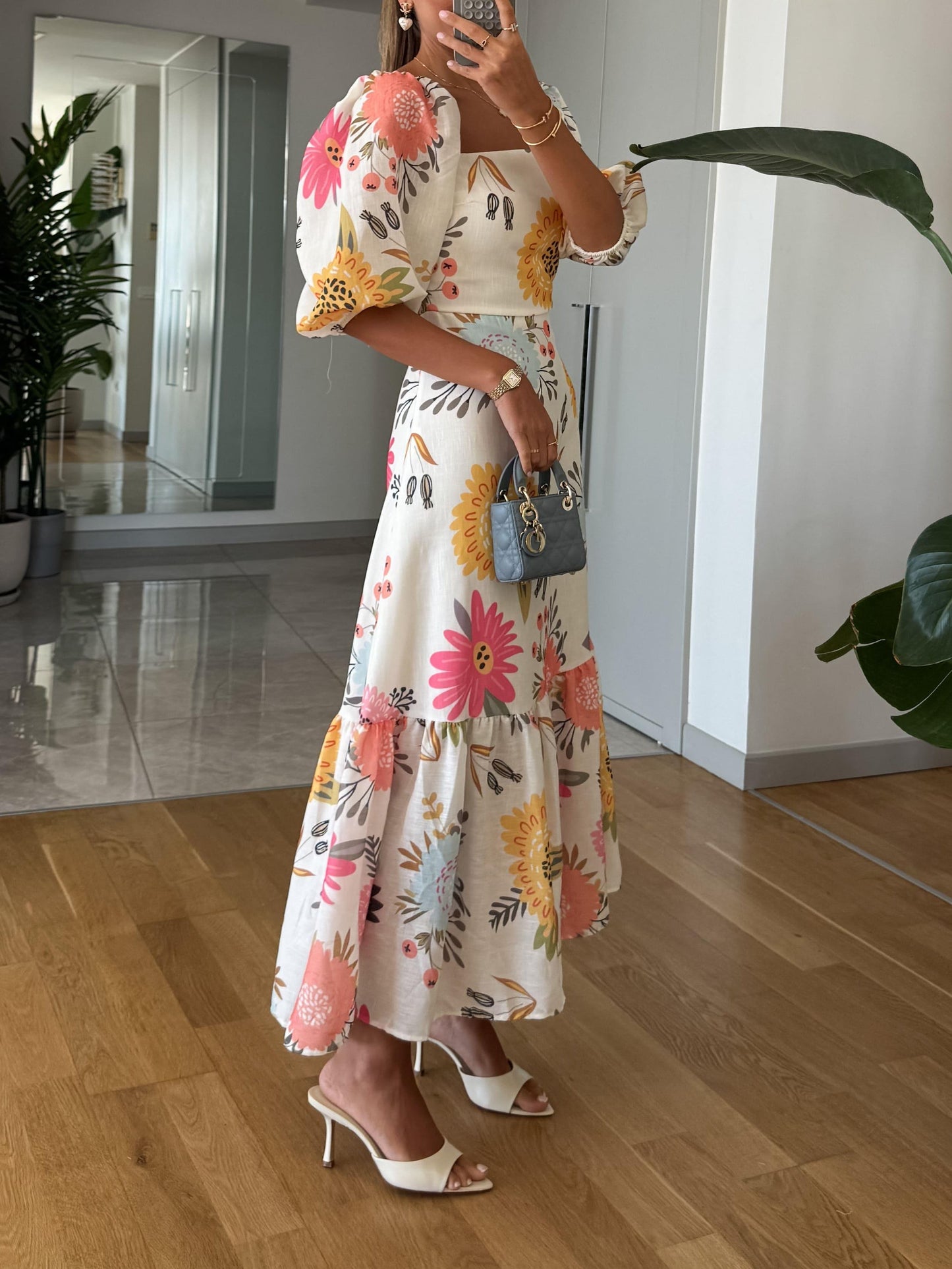 elegant white midi dress with floral print in pink yellow and blue for women square neck puff sleeves sophisticated feminine fashion perfect for events