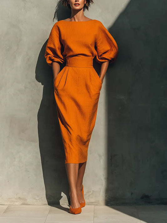 CONJUNTO NARANJA CON TOP ESTRUCTURADO Y FALDA MIDI. ELEGANTE, MODERNO Y PERFECTO PARA EVENTOS, CENAS O OCASIONES ESPECIALES. CONSÍGUELO HOY