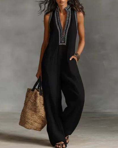 elegant black sleeveless jumpsuit for women with high neck zipper and embroidered details modern timeless silhouette ideal for city outings dinners and elevated everyday style