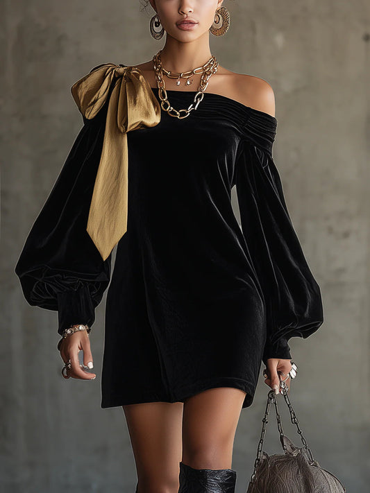 elegant black velvet mini dress for women with off shoulder design and gold bow detail sophisticated feminine fashion perfect for events and parties