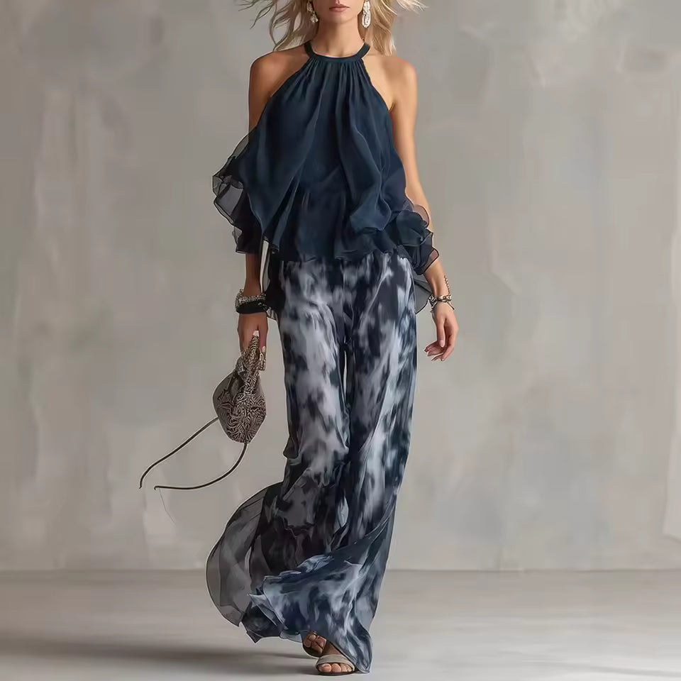 elegant blue halter top and printed wide leg pants set for women with flowy chiffon effect silhouette ideal for summer events dinners vacations and sophisticated occasions