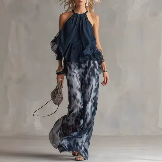 elegant blue halter top and printed wide leg pants set for women with flowy chiffon effect silhouette ideal for summer events dinners vacations and sophisticated occasions
