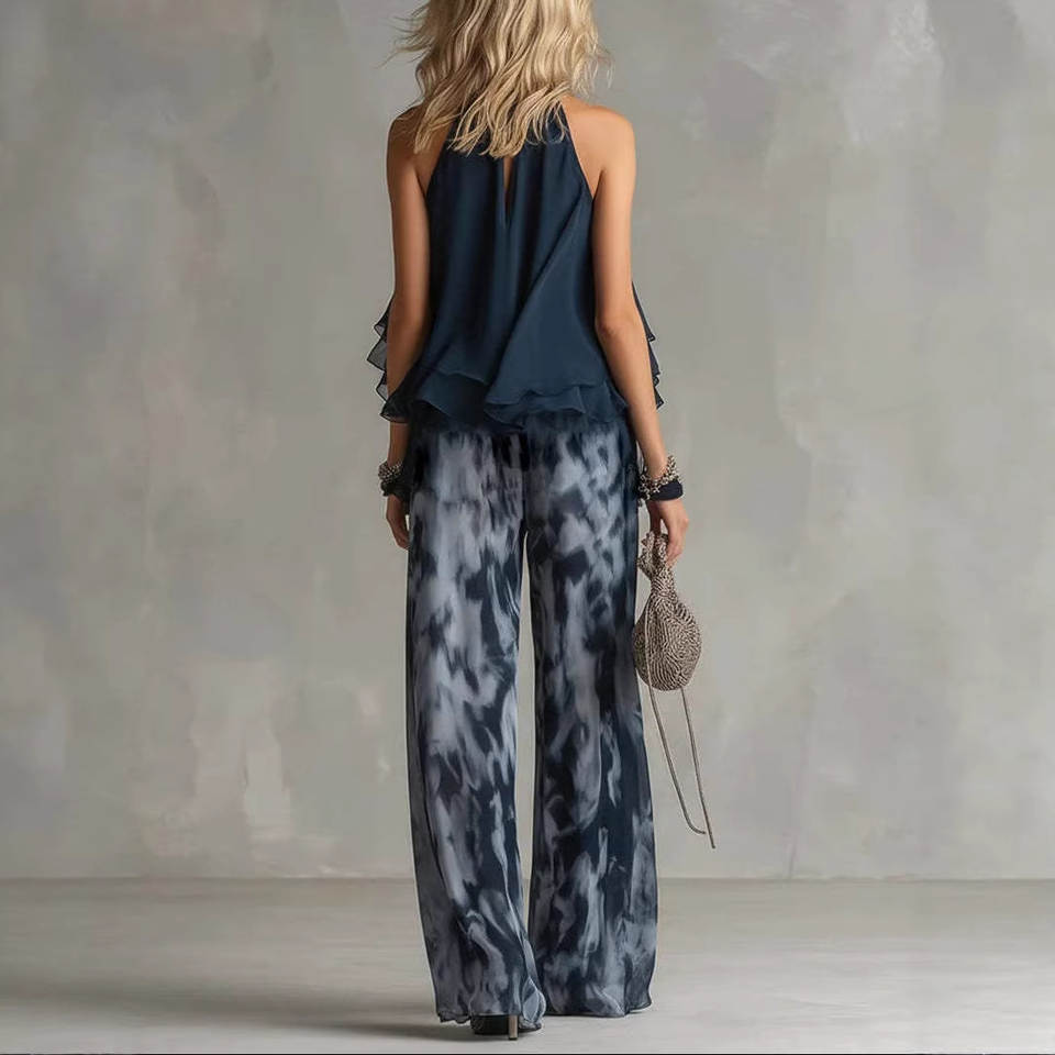 elegant two piece set for women back view with blue halter top and printed wide leg pants lightweight flowy design ideal for stylish events and resort wear