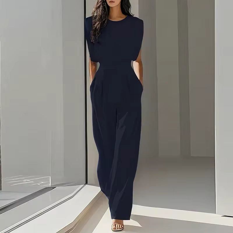 elegant blue sleeveless jumpsuit for women with round neckline and flattering belted waist versatile feminine silhouette ideal for office wear events and stylish occasions