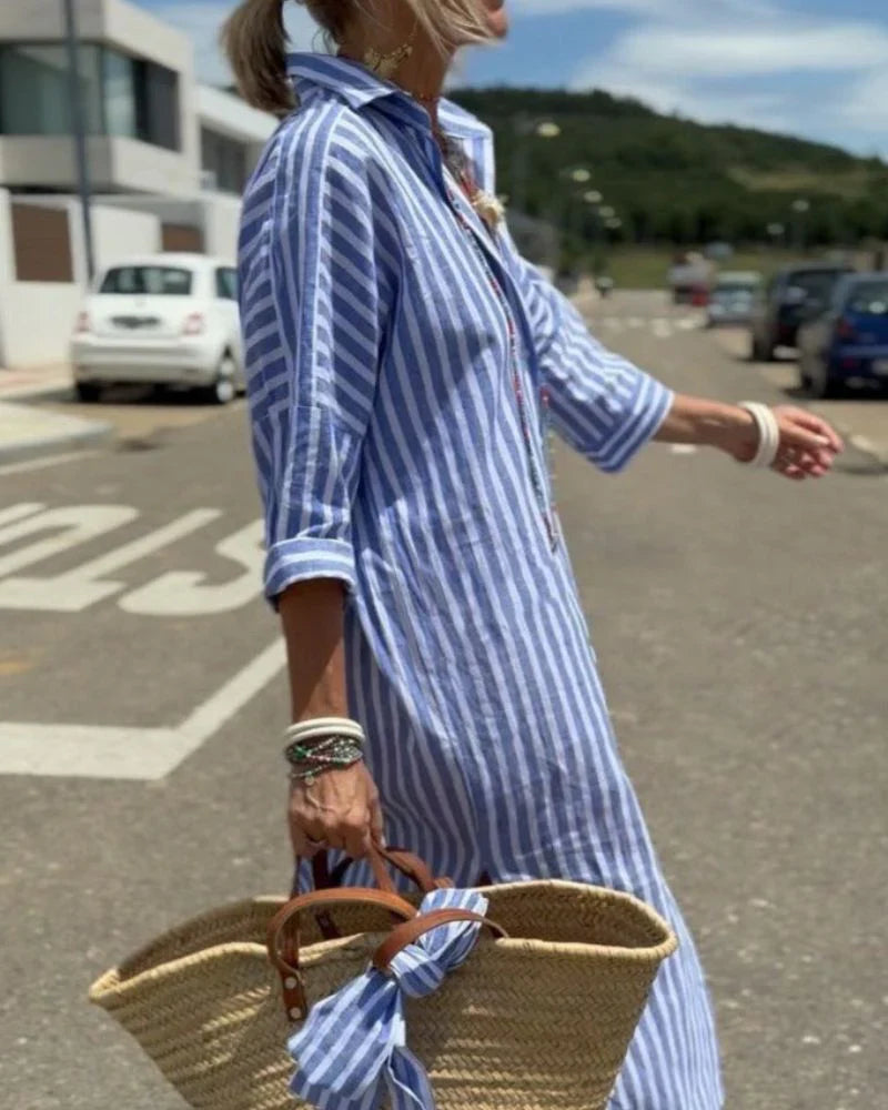 side view of blue striped shirt midi dress in motion highlighting the flowing silhouette comfortable fit and timeless resort wear style for holidays and outdoor walks