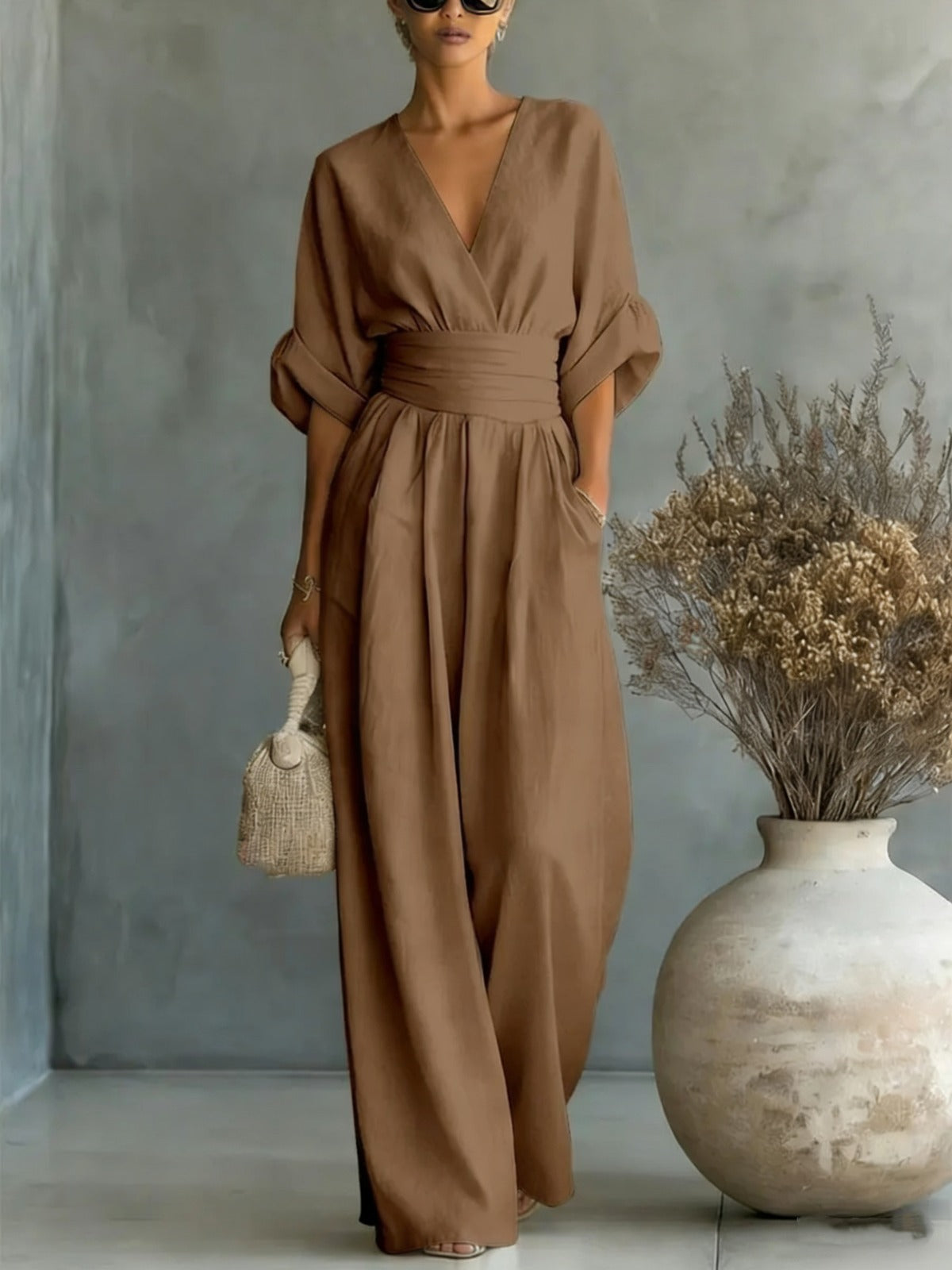 elegant brown long jumpsuit for women with deep v neck and three quarter sleeves refined feminine fashion perfect for events and stylish occasions