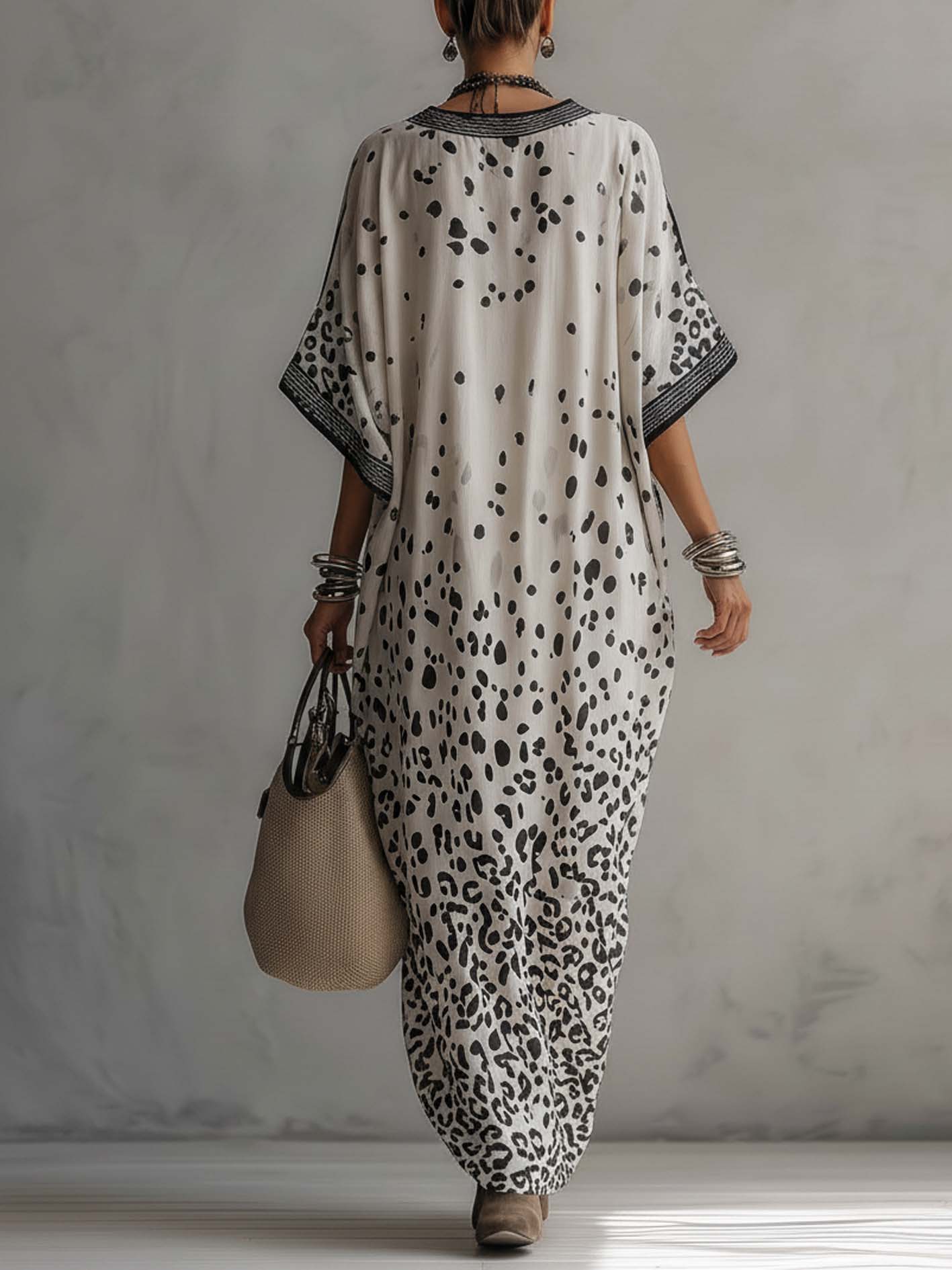 back view of gray ombre leopard chiffon maxi dress with fluid silhouette and graceful drape perfect for vacations beachside dinners and elegant summer occasions