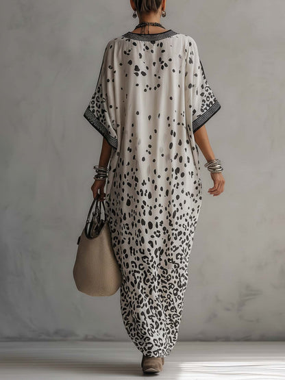 back view of gray ombre leopard chiffon maxi dress with fluid silhouette and graceful drape perfect for vacations beachside dinners and elegant summer occasions