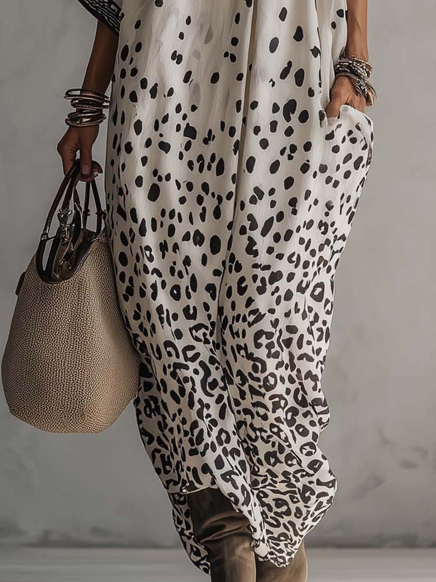 close up of flowing chiffon skirt with gray ombre leopard print showcasing lightweight movement elegant resort wear style and sophisticated summer fashion