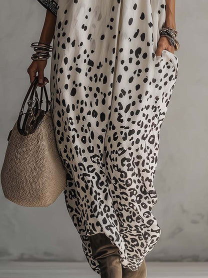 close up of flowing chiffon skirt with gray ombre leopard print showcasing lightweight movement elegant resort wear style and sophisticated summer fashion