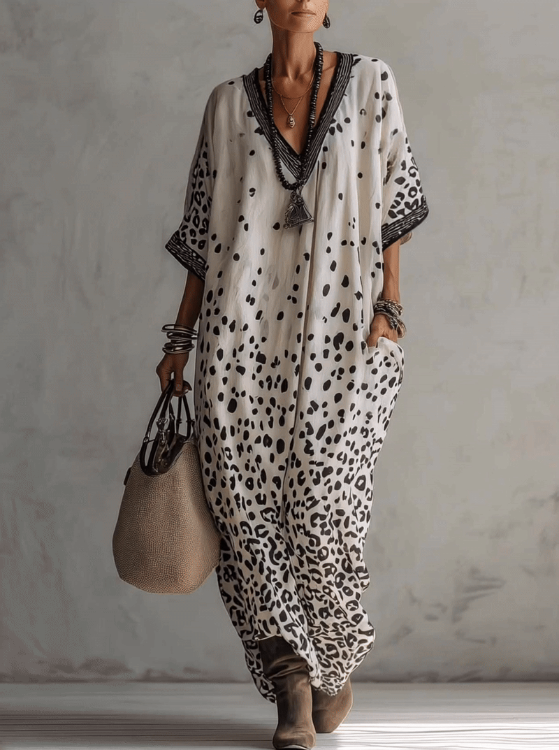 gray ombre leopard chiffon maxi dress in motion showcasing fluid movement lightweight fabric and elegant resort wear styling perfect for vacations and coastal escapes