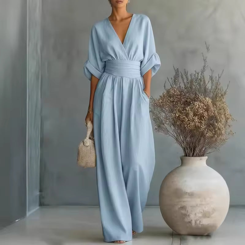 elegant light blue long jumpsuit for women with deep v neck and three quarter sleeves sophisticated feminine fashion perfect for events and occasions