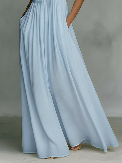 elegant light blue sleeveless maxi dress for women skirt detail with pleated flowy fabric refined feminine fashion perfect for stylish occasions
