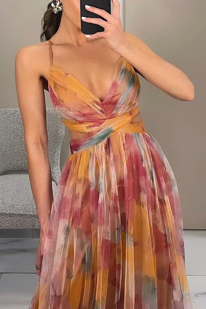 close up of orange floral pleated maxi dress featuring elegant bodice floral print and refined craftsmanship ideal for ceremonies weddings and formal events