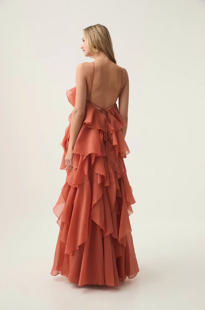 back view of red halter maxi dress with layered ruffles and graceful movement romantic feminine occasion wear for celebrations and outdoor events