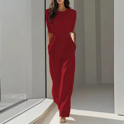 elegant red sleeveless jumpsuit for women with round neckline and belted waist confident feminine silhouette ideal for celebrations dinners events and statement occasion wear
