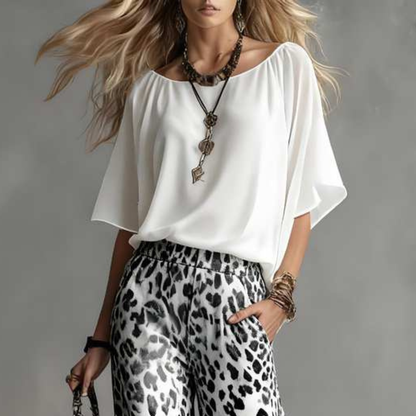 close up of elegant white blouse featuring refined tailoring and versatile styling ideal for smart casual outfits vacations and contemporary feminine wardrobes