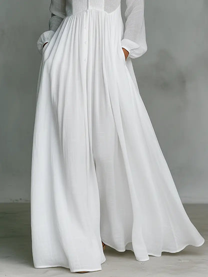 close up of white cotton linen maxi dress with flowy skirt and relaxed silhouette elegant minimalist fashion for women inspired by quiet luxury style