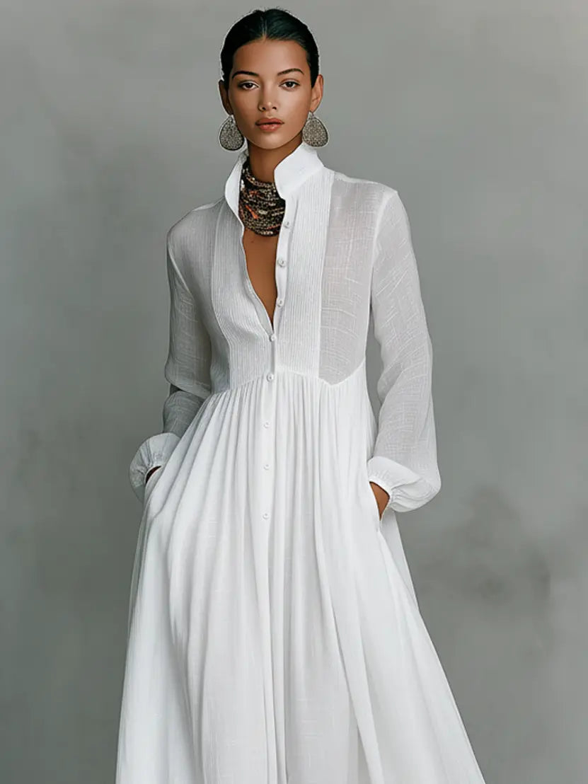 close up of white cotton linen maxi dress featuring mao collar button placket and long sleeves refined minimalist womens fashion with timeless appeal