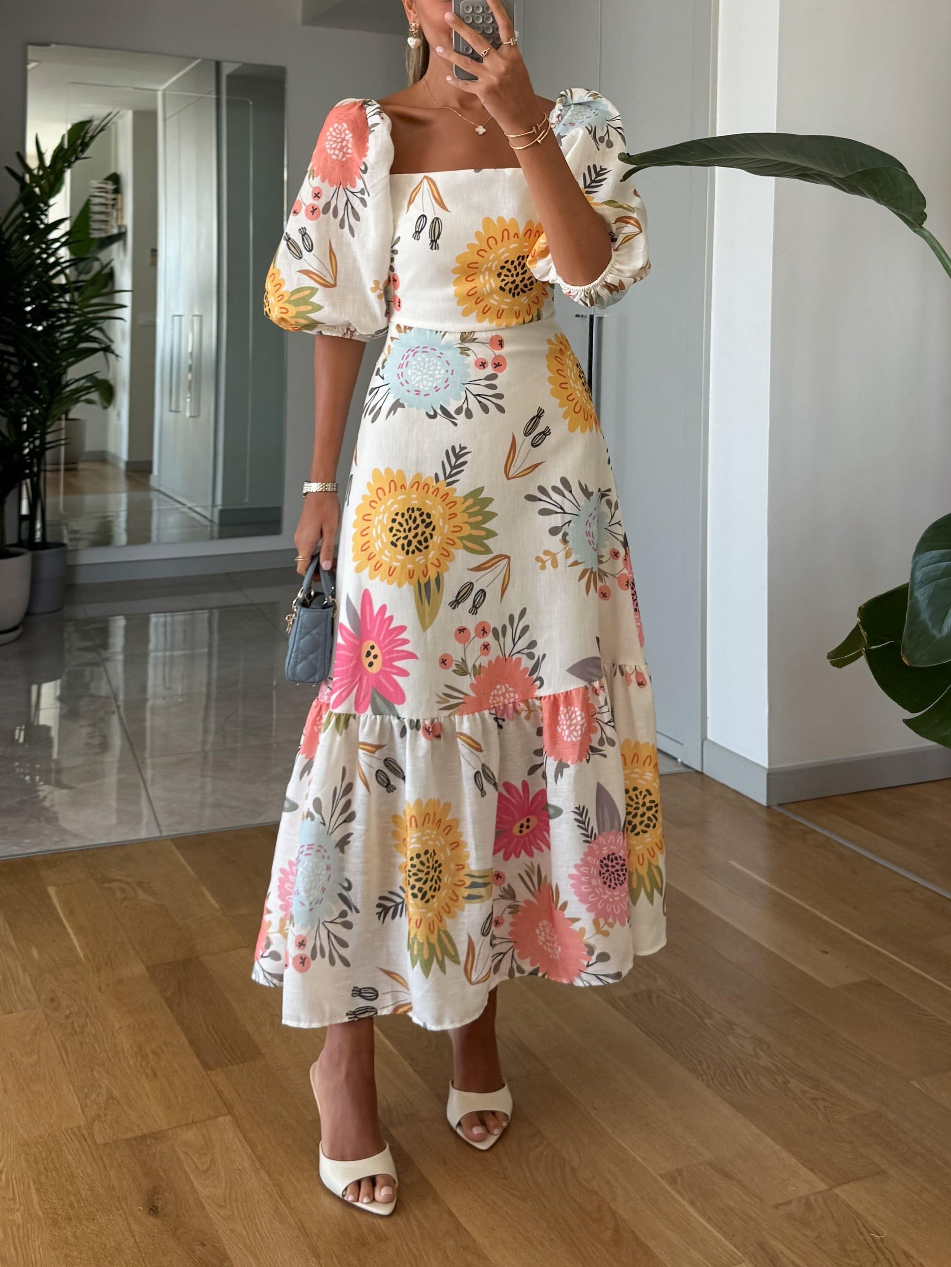 elegant white floral midi dress for women with square neck and puff sleeves pink yellow and blue print sophisticated feminine fashion perfect for events and dinners