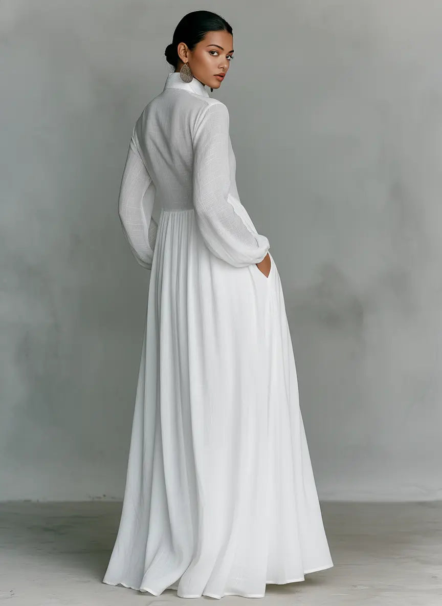 back view of white cotton linen maxi dress for women with long sleeves flowy silhouette and minimalist design ideal for elegant everyday wear and travel
