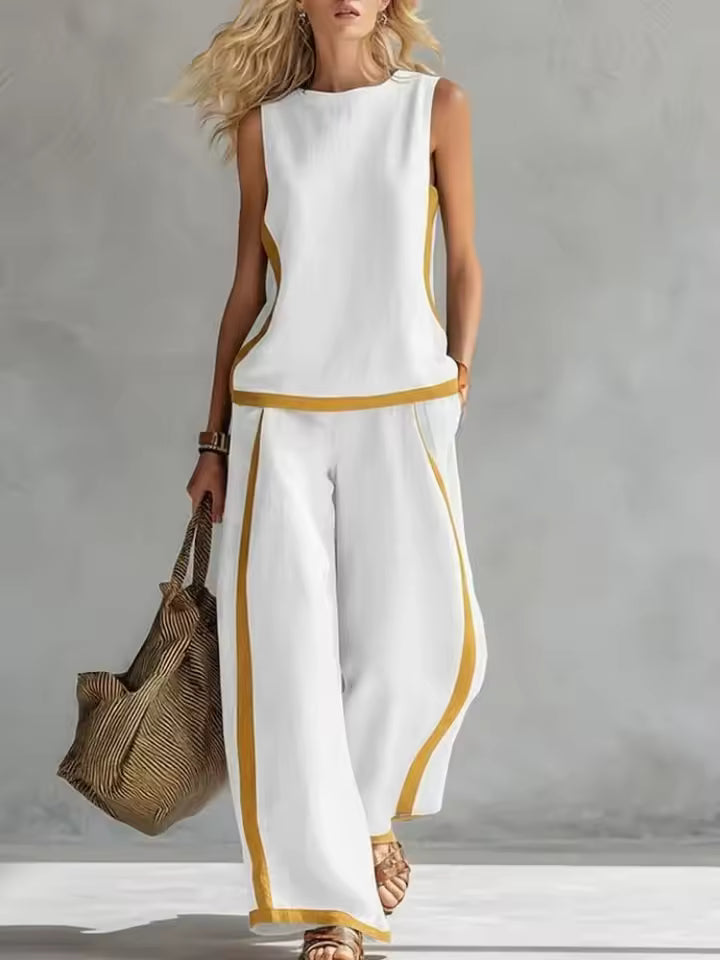 elegant white two piece set for women with sleeveless blouse and wide leg pants sophisticated versatile comfortable feminine fashion ideal for office outfits