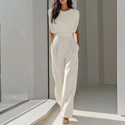 elegant white sleeveless jumpsuit for women with round neck and belt sophisticated feminine fashion perfect for events dinners and special occasions