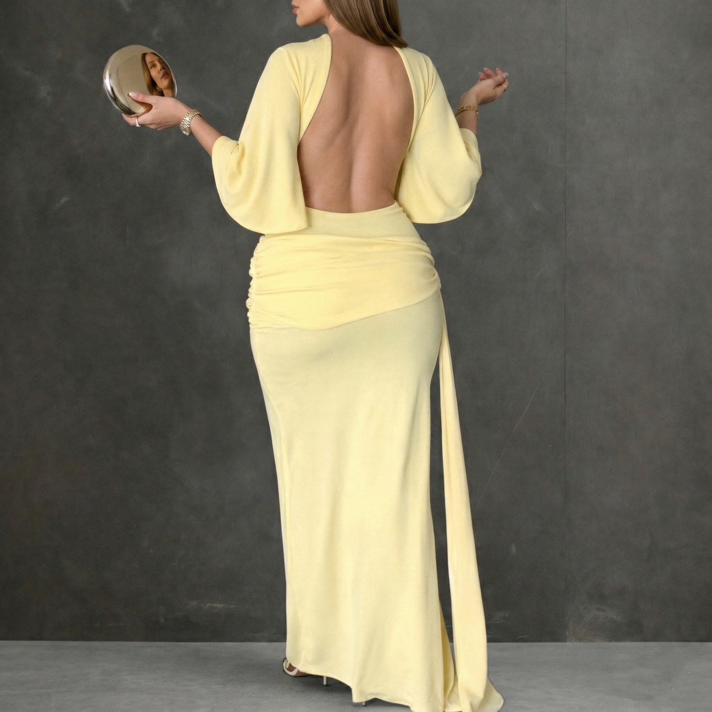 elegant yellow backless maxi dress for women back view refined feminine fashion perfect for events dinners and elegant occasions