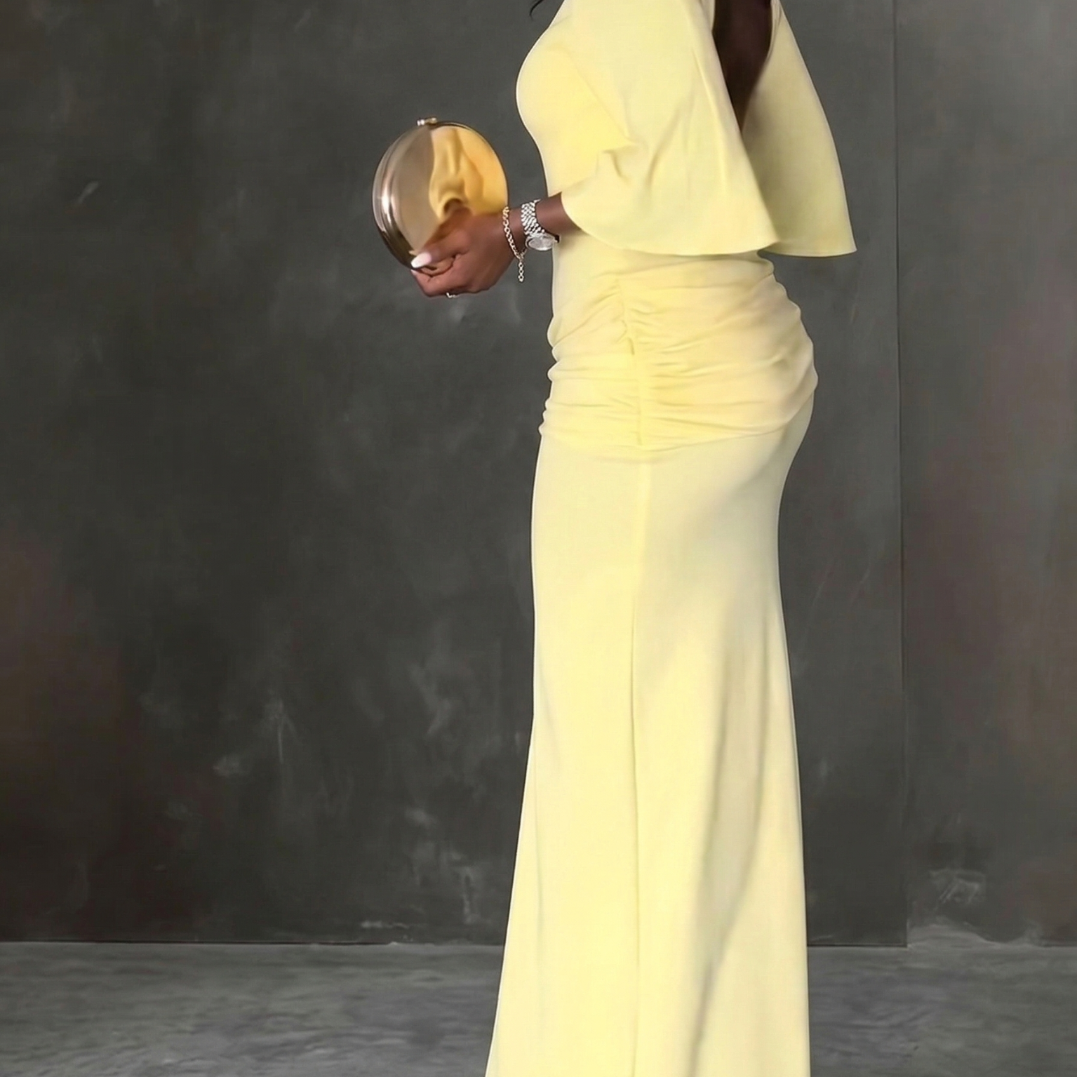 elegant yellow backless maxi dress for women side view refined feminine fashion perfect for events dinners and special occasions