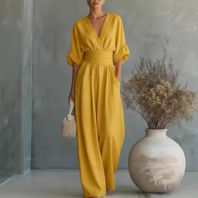 elegant yellow long jumpsuit for women with deep v neck and three quarter sleeves sophisticated feminine fashion perfect for events and occasions